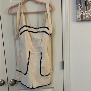 Cream Romper with Black Trim